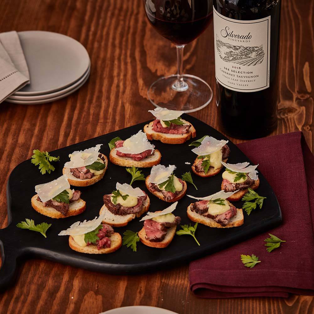 Seared Beef Carpaccio Crostini with Dijon Caper Aioli and Shaved Parmesan square